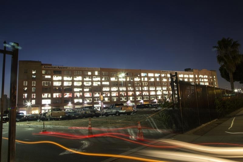 © Reuters. Automobile light streaks are pictured at the American Apparel factory headquarters in Los Angeles, California