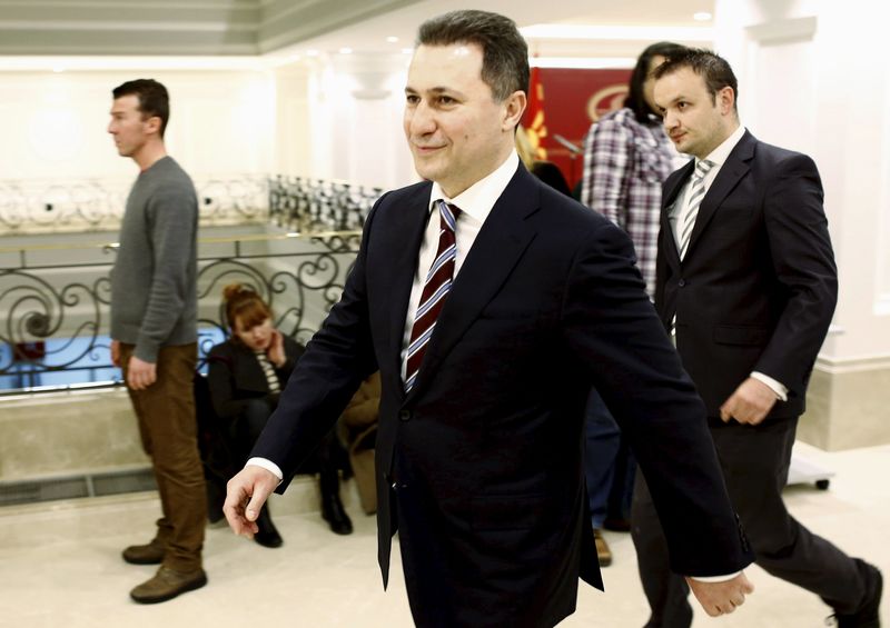 © Reuters. Macedonian Prime Minister Nikola Gruevski leave after the news conference in Skopje