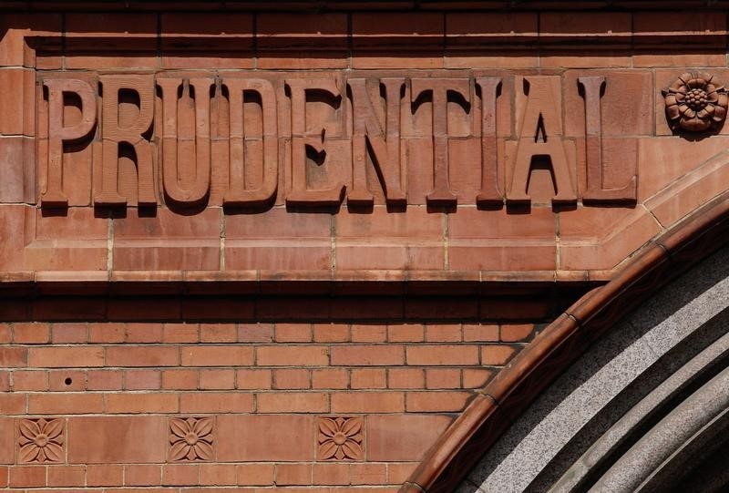 © Reuters. Raised lettering in the brickwork of the former Prudential Assurance building casts shadows in the City of London
