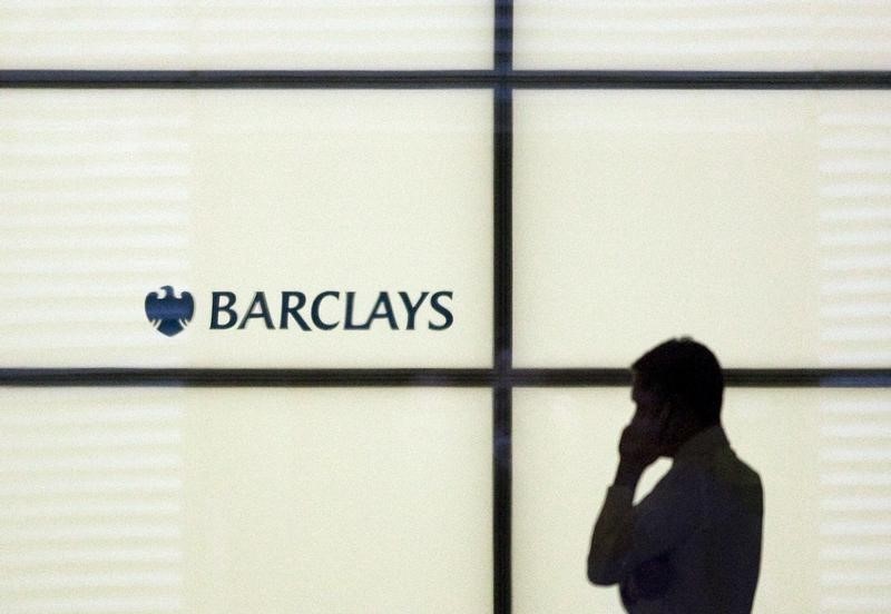 © Reuters. Мужчина говорит по телефону в отделении Barclays