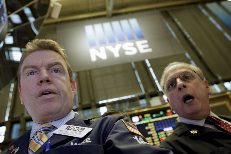 © Reuters. Specialist trader Michael O'Mara works at his post on the floor of the New York Stock Exchange