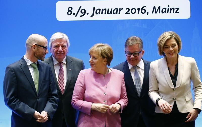 © Reuters. German Chancellor Merkel arrives with her duputy party leaders for CDU party leadership meeting in Mainz