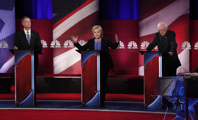 © Reuters. Democratic U.S. presidential candidate Clinton speaks as she discusses issues with O'Malley and Sanders at the NBC News - YouTube Democratic presidential candidates debate in Charleston