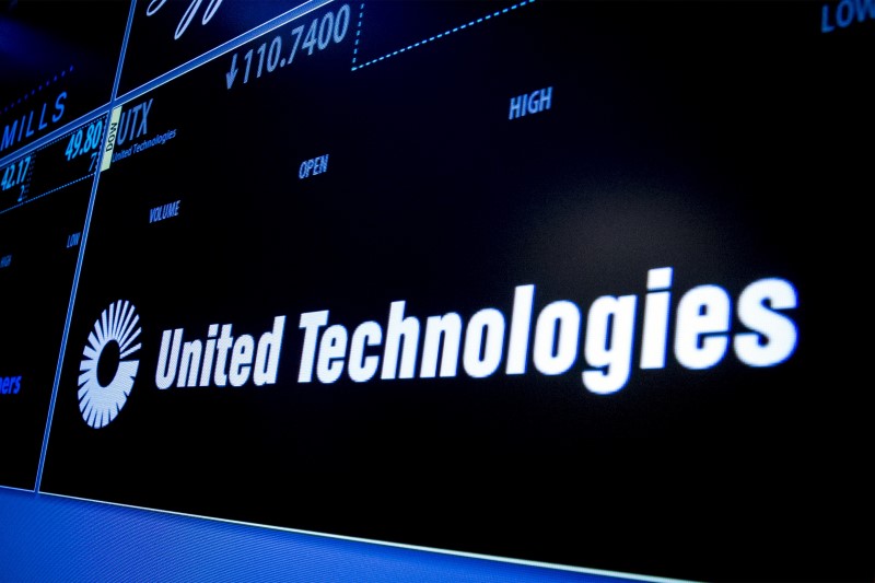 © Reuters. Ticker symbol for United Technologies is displayed on a screen on the floor of the New York Stock Exchange 