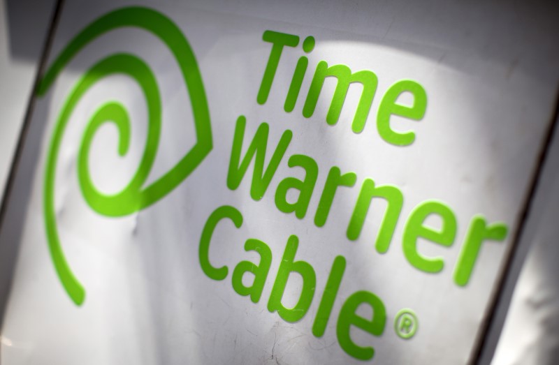 © Reuters. A Time Warner Cable sign and logo are seen on the back of a Time Warner Cable service truck in the Manhattan borough of New York City