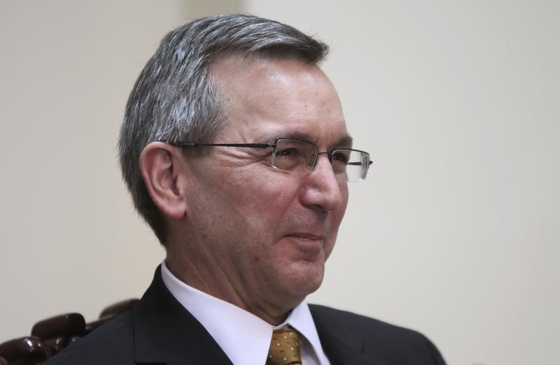 © Reuters. U.S. Principal Deputy Assistant Secretary Scot Marciel smiles during a meeting with Ouch Borith, secretary of state at the Foreign Affairs Ministry, in Phnom Penh