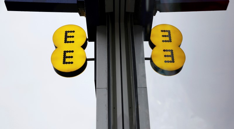 © Reuters. File photograph of the EE logo reflected in a window outside an EE shop  in London