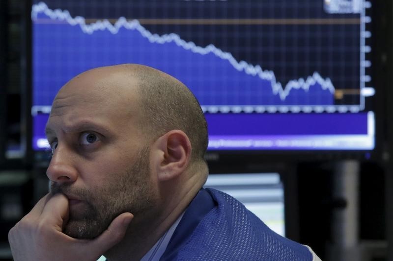 © Reuters. Specialist trader Meric Greenbaum works at his post on the floor of the New York Stock Exchange 