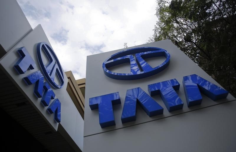 © Reuters. Tata Motors logos are seen at their flagship showroom before the announcement of their Q3 results in Mumbai