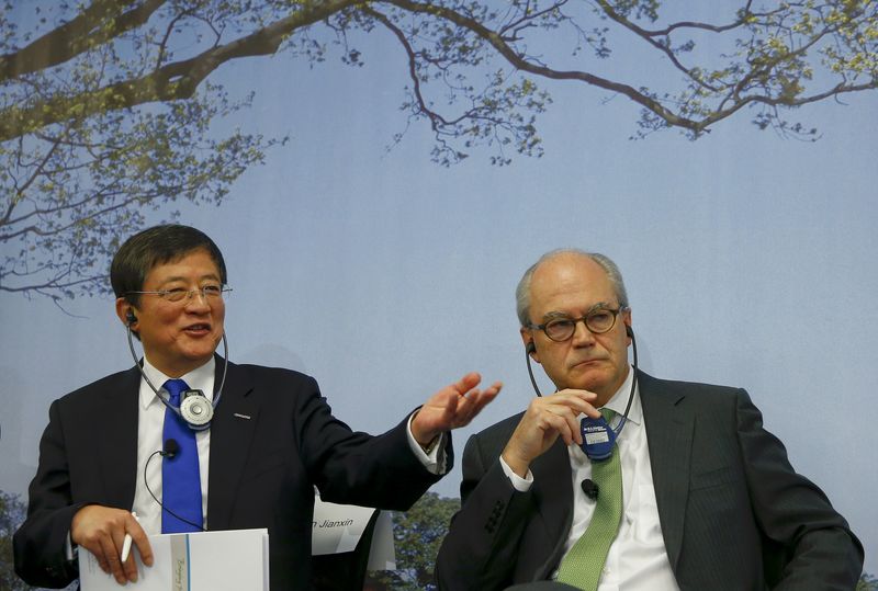 © Reuters. President of Syngenta Demare and Chairman of China National Chemical Corp Ren address annual news conference in Basel