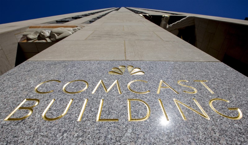 © Reuters. The NBC logo and Comcast are displayed on 30 Rockefeller Plaza in Manhattan, New York