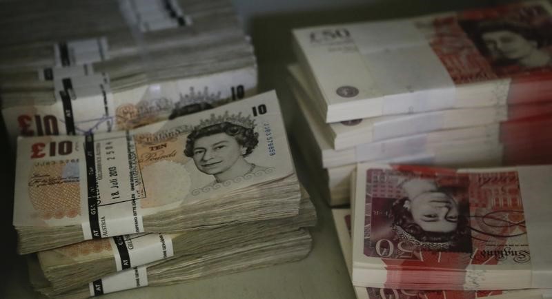 © Reuters. Wads of Pound Sterling banknotes are pictured at the GSA company's headquarters in Vienna