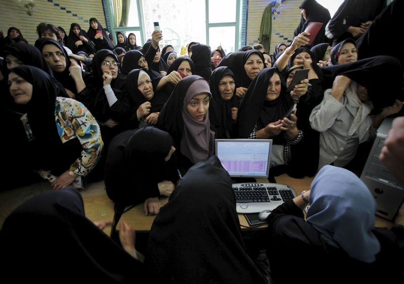 © Reuters. File picture of Iranian women waiting to cast their votes during the Iranian presidential election, in Tehran