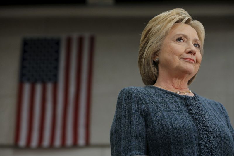 © Reuters. U.S. Democratic presidential candidate Hillary Clinton listens as she is introduced at a "Get Out the Vote" campaign rally in Concord