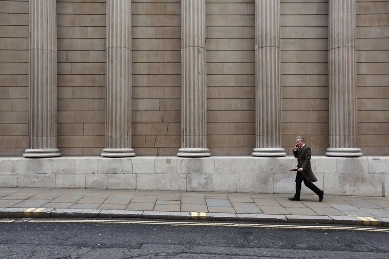 © Reuters. A man walks past the Bank of England in London, Britain  