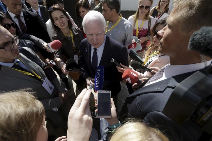© Reuters. McCain speaks to media during the inauguration ceremony of the NATO StratCom COE in Riga