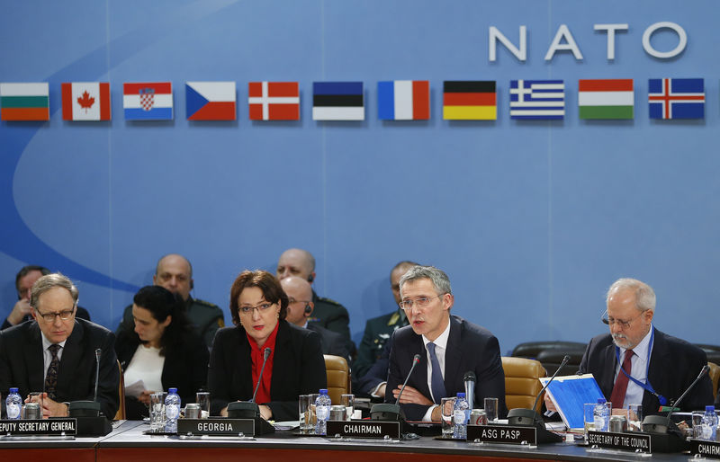 © Reuters. Georgia's Minister of Defence Tinatin Khidasheli and NATO Secretary General Jens Stoltenberg address a NATO-Georgia Commission defense ministers meeting at the Alliance's headquarters in Brussels