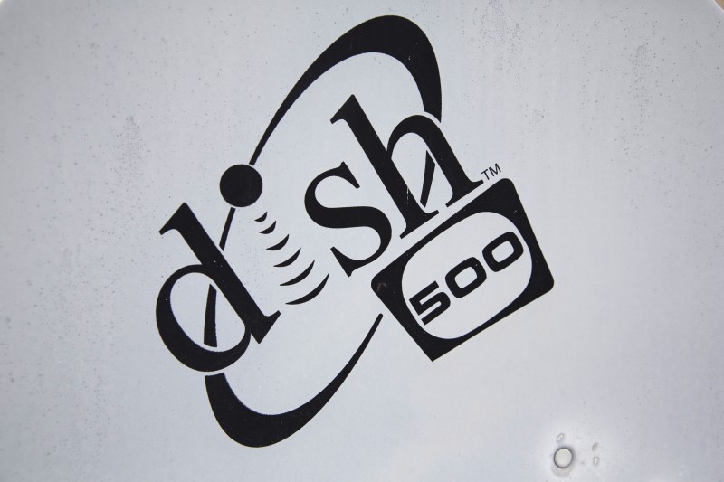 © Reuters. A Dish Network logo is seen on a satellite dish on a Brooklyn apartment building roof in New York 