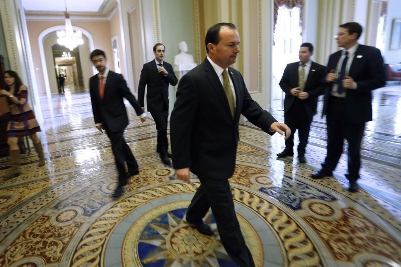 © Reuters. Lee walks to the Senate floor 