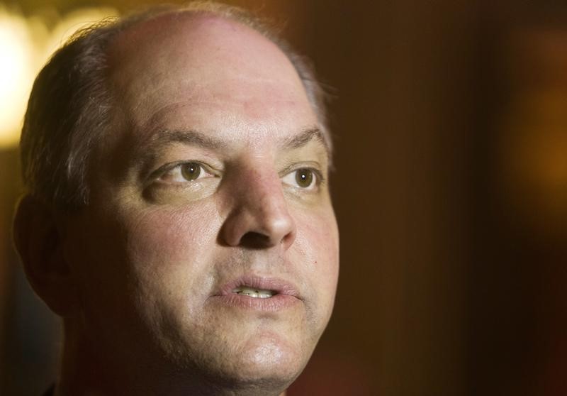 © Reuters. John Bel Edwards speaks to reporters during a Veterans Day event in Baton Rouge, Louisiana.