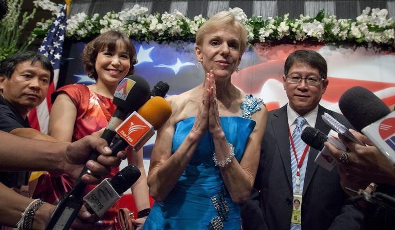 © Reuters. Kristie Kenney puts her hands together in a traditional Thai greeting in Bangkok