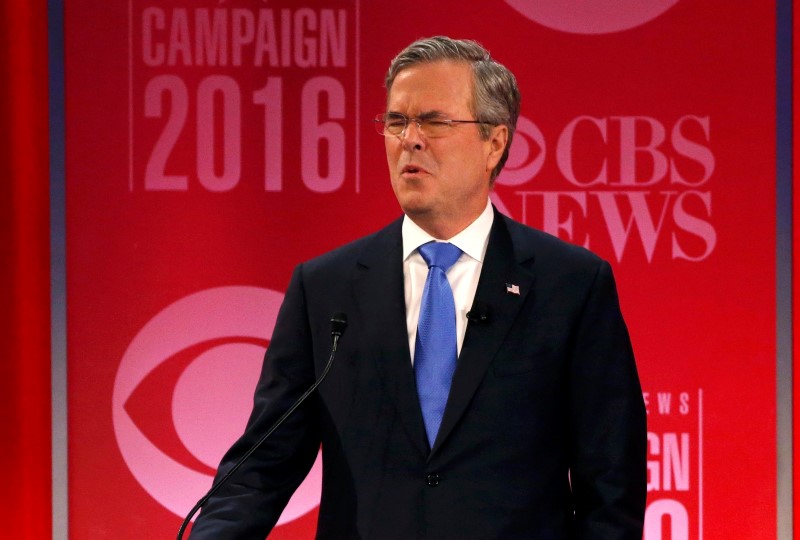 © Reuters. Republican U.S. presidential candidate Bush reacts to an attack from rival candidate Trump at the Republican U.S. presidential candidates debate sponsored by CBS News and the Republican National Committee in Greenville