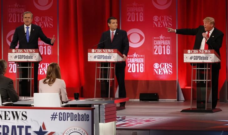 © Reuters. Republican U.S. presidential candidates Bush and Trump speak at the same time at the Republican U.S. presidential candidates debate sponsored by CBS News and the Republican National Committee in Greenvill