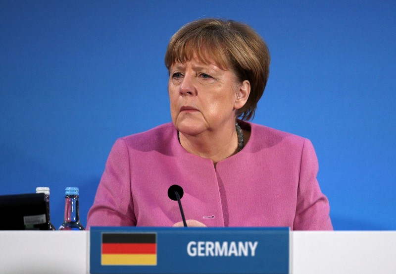 © Reuters. German Chancellor Angela Merkel speaks at the donors Conference for Syria in London