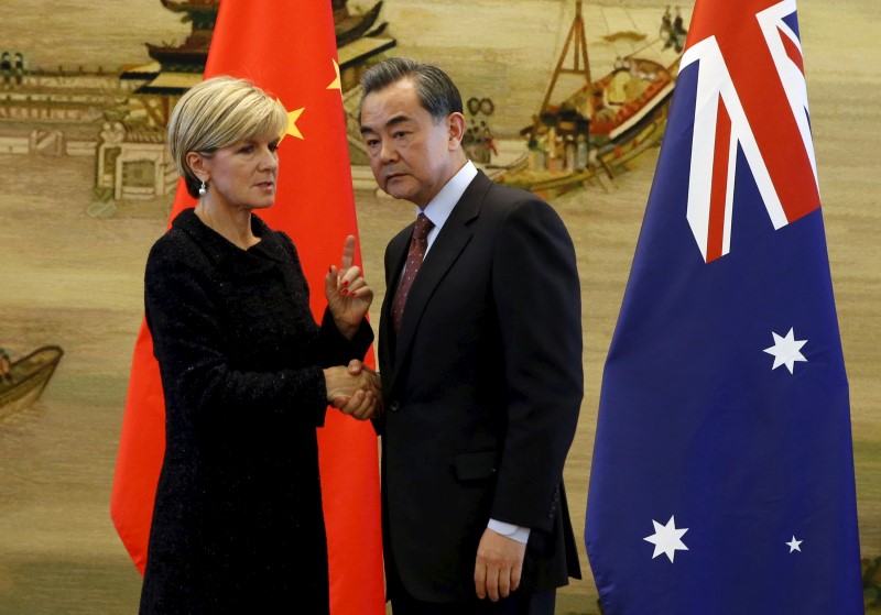 © Reuters. Australian Foreign Minister Julie Bishop talks with Chinese Foreign Minister Wang Yi after their joint news conference at the Ministry of Foreign Affairs in Beijing