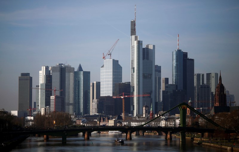 © Reuters. The banking district with the headquarters of Germany's second largest business bank, Commerzbank AG (highest building, centre) is seen from a bridge in Frankfurt