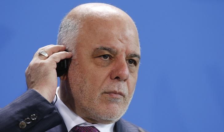 © Reuters. Iraq's Prime Minister al-Abadi listens to a translation during a news conference at the Chancellery in Berlin