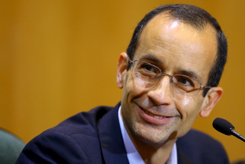 © Reuters. Odebrecht, the head of Latin America's largest engineering and construction company Odebrecht SA, smiles as he gives his testimony in a session of the Parliamentary Committee of Inquiry in Curitiba