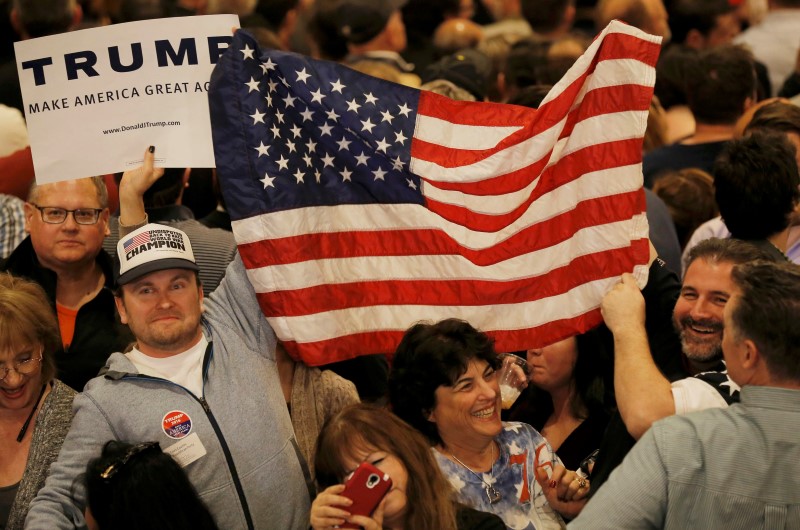 © Reuters. Supporters of Republican U.S. presidential candidate Donald Trump celebrate after Trump was declared the winner of the Nevada Republican caucuses by the television networks, at his Nevada caucus night rally in Las Vegas