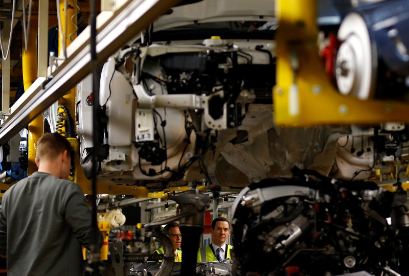 © Reuters. Britain's Chancellor of the Exchequer George Osborne looks at a car on the production line at Bentley Motors in Crewe