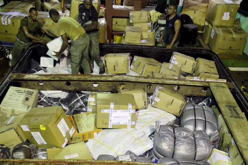 © Reuters. UNICEF Pacific emergency supplies bound for remote Koro Island are loaded onto a ship in Suva following Cyclone Winston in this picture supplied by UNICEF.