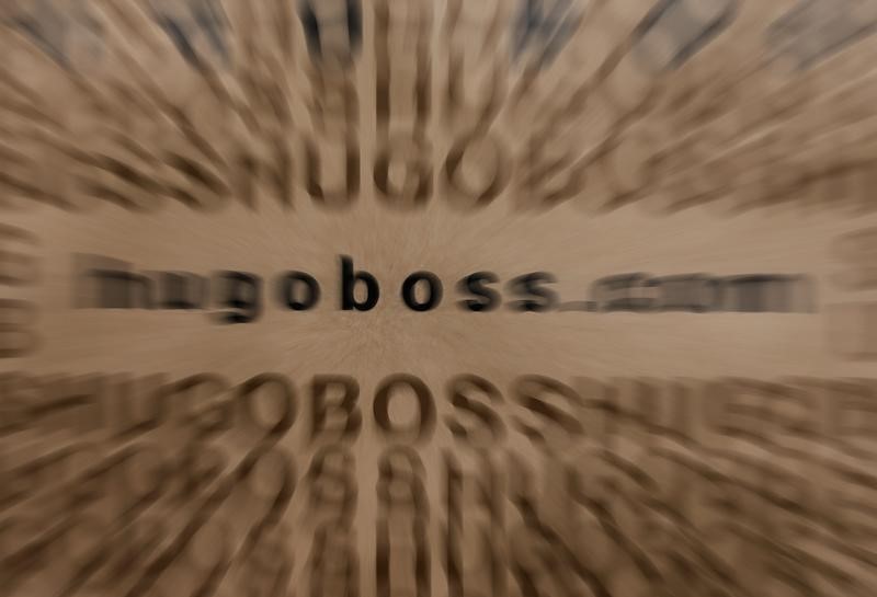 © Reuters. The logo of German fashion house Hugo Boss is seen on a bag at their outlet store in Mezingen near Stuttgart