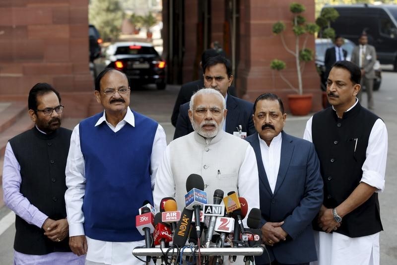 © Reuters. India's PM Modi speaks with the media inside the parliament premises upon his arrival on the first day of the budget session in New Delhi