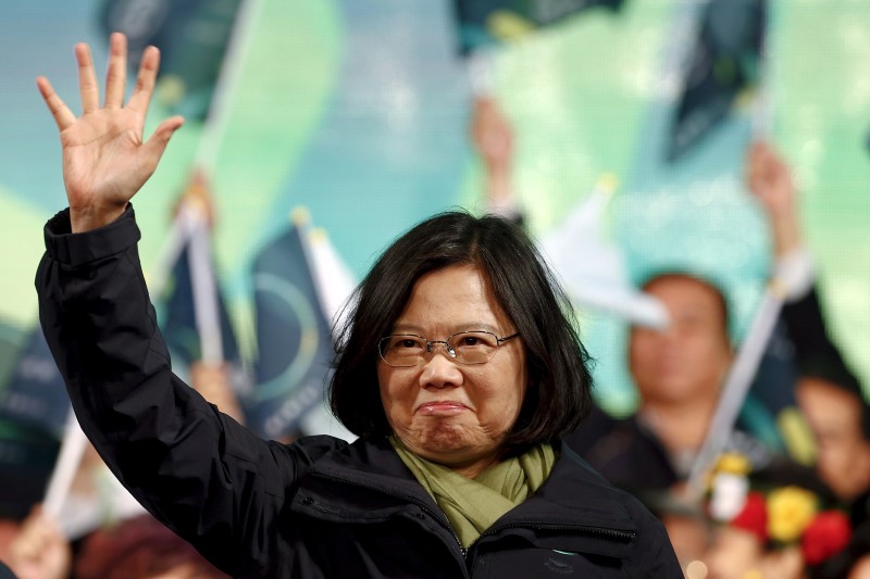 © Reuters. File photo of Democratic Progressive Party Chairperson and presidential candidate Tsai Ing-wen greeting supporters after her election victory at party headquarters in Taipei