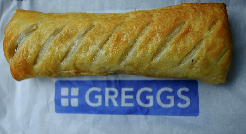© Reuters. A sausage roll is seen on top of a bag at a Greggs bakery in Manchester