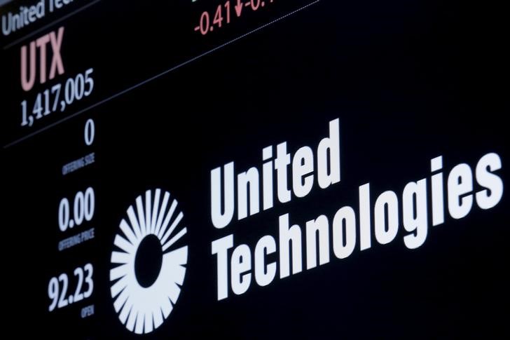 © Reuters. The ticker symbol for for United Technologies is displayed at the post where it is traded  on the floor of the NYSE 