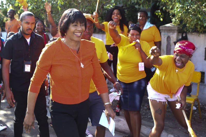 © Reuters. Jamaica's PM Portia Simpson-Miller arrives to cast her vote at a polling station during general election in Kingston, Jamaica 