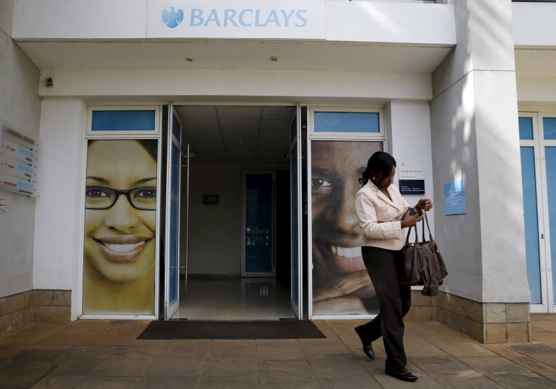 © Reuters. A woman walks from a banking hall within the Barclays Bank Kenya head offices in the capital Nairobi