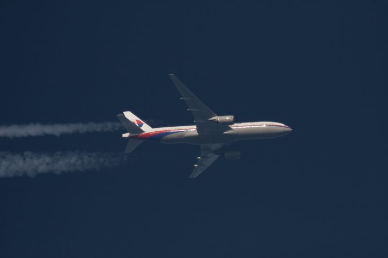 © Reuters. File photo of Malaysia Airlines Boeing 777 plane with registration number 9M-MRO flying over Poland