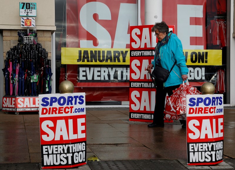 © Reuters. A pedestrian walks past a branch of Sports Direct in Liverpool northern England