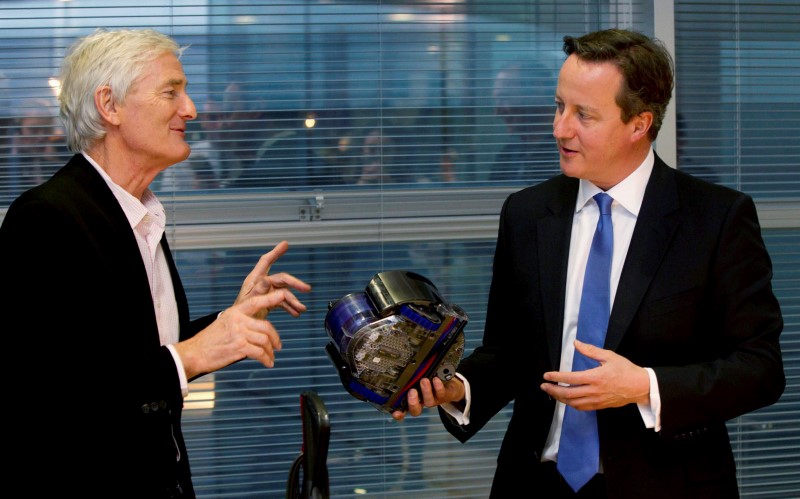 © Reuters. Britain's Prime Minister Cameron views vacuum design products with Dyson at the Dyson headquarters in Malmesbury , south west England