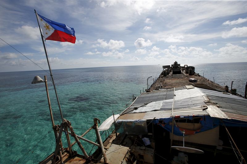 © Reuters. A Philippine flag flutters from BRP Sierra Madre, a dilapidated Philippine Navy ship that has been aground since 1999 and became a Philippine military detachment on the disputed Second Thomas Shoal