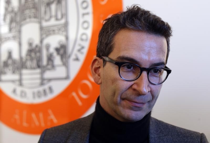 © Reuters. Marchetti founder and CEO of Yoox Net-A-Porter Group looks on before a meeting in Bologna