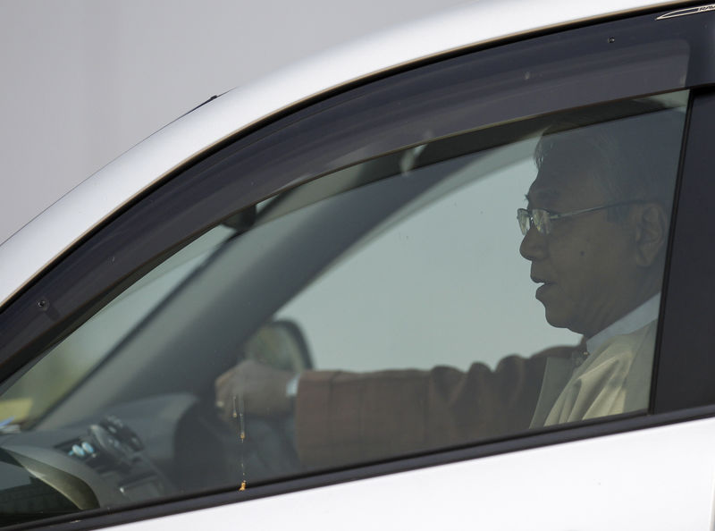 © Reuters. Htin Kyaw, the National League for Democracy nominated presidential candidate for the lower house of parliament, leaves parliament in Naypyitaw