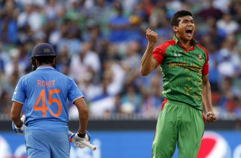 © Reuters. Bangladesh's Taskin Ahmed reacts after bowling out India's batsman Rohit Sharma during their Cricket World Cup quarter-final match in Melbourne