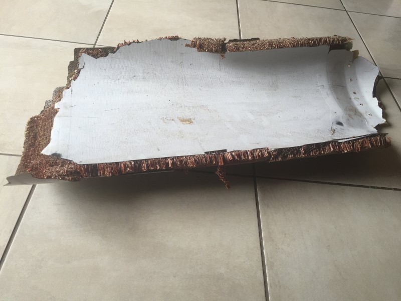 © Reuters. Handout photo of piece of debris found by a South African family off the Mozambique coast, which authorities will examine to see if it is from missing Malaysia Airlines flight MH370